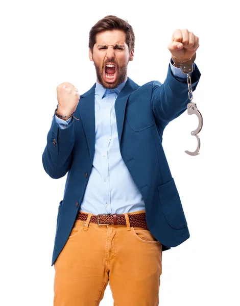 Happy businessman with handcuffs — Stock Photo, Image