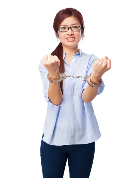 Worried chinese woman with handcuffs — Stock Photo, Image