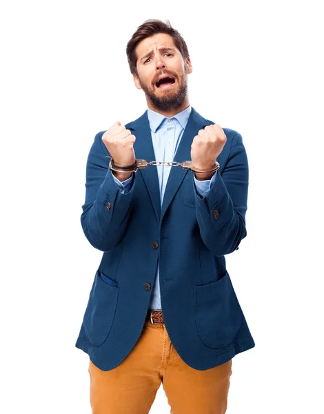 Happy businessman with handcuffs — Stock Photo, Image