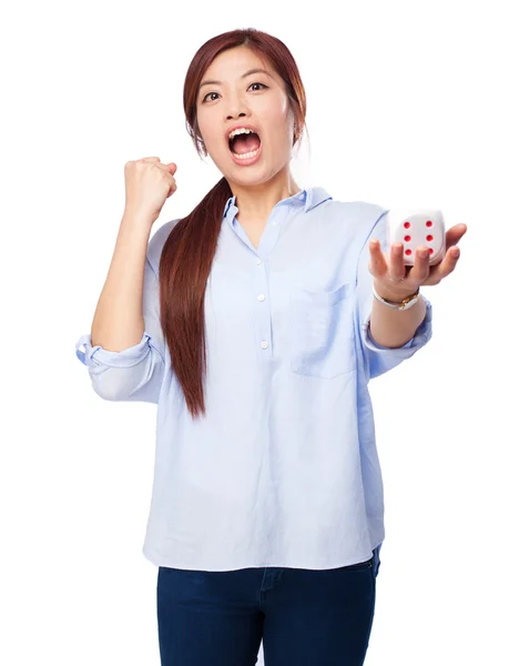 Chinese woman celebrating gesture with dice — Stock Photo, Image