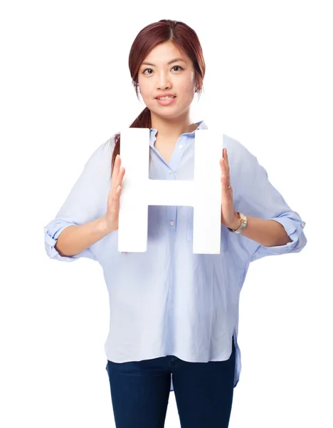 Happy chinese woman with h letter — Stock Photo, Image