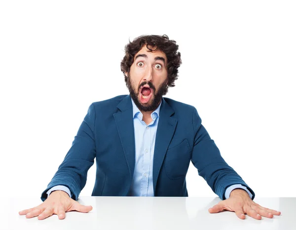 Worried businessman with sit table — Stock Photo, Image