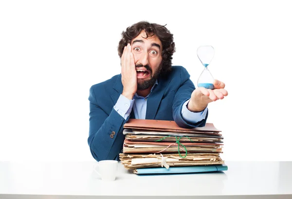 Geschäftsmann mit Akten und Sanduhr — Stockfoto