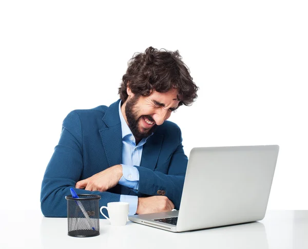 Homem de negócios rindo com laptop — Fotografia de Stock