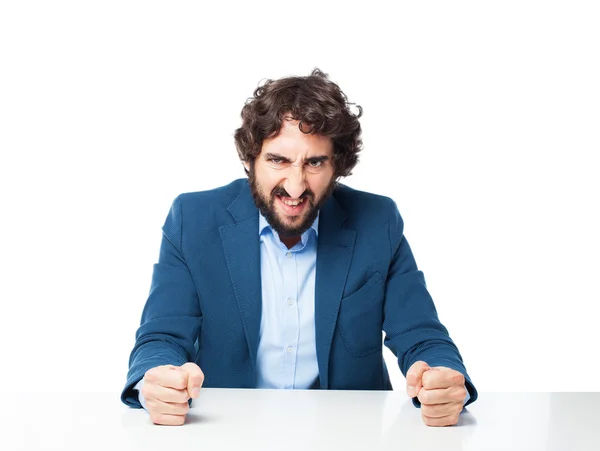 Hombre de negocios enojado con sentarse mesa — Foto de Stock