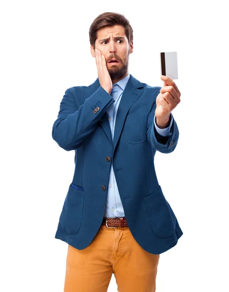 Worried businessman with credit card — Stock Photo, Image