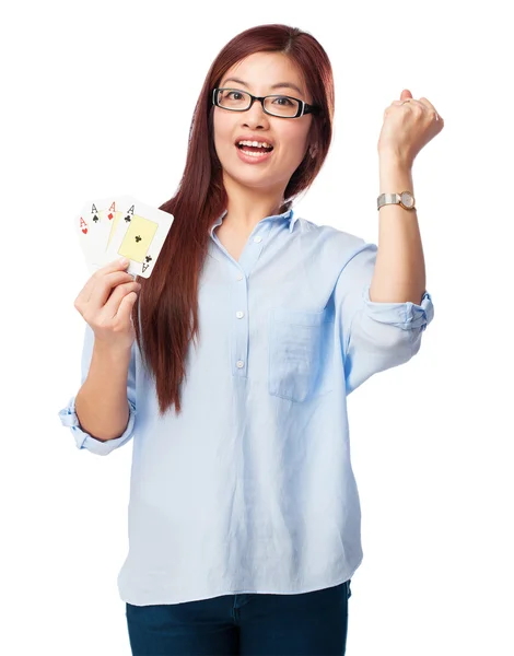 Happy chinese woman with poker cards — Stock Photo, Image