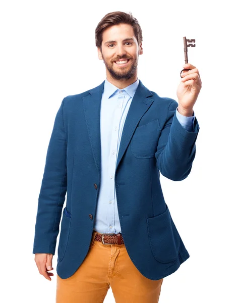 Homem de negócios feliz com chave vintage — Fotografia de Stock