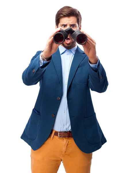 Hombre de negocios en busca de prismáticos — Foto de Stock