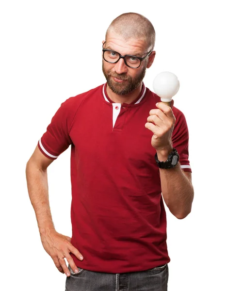 Young man thinking with light bulb — Stock Photo, Image