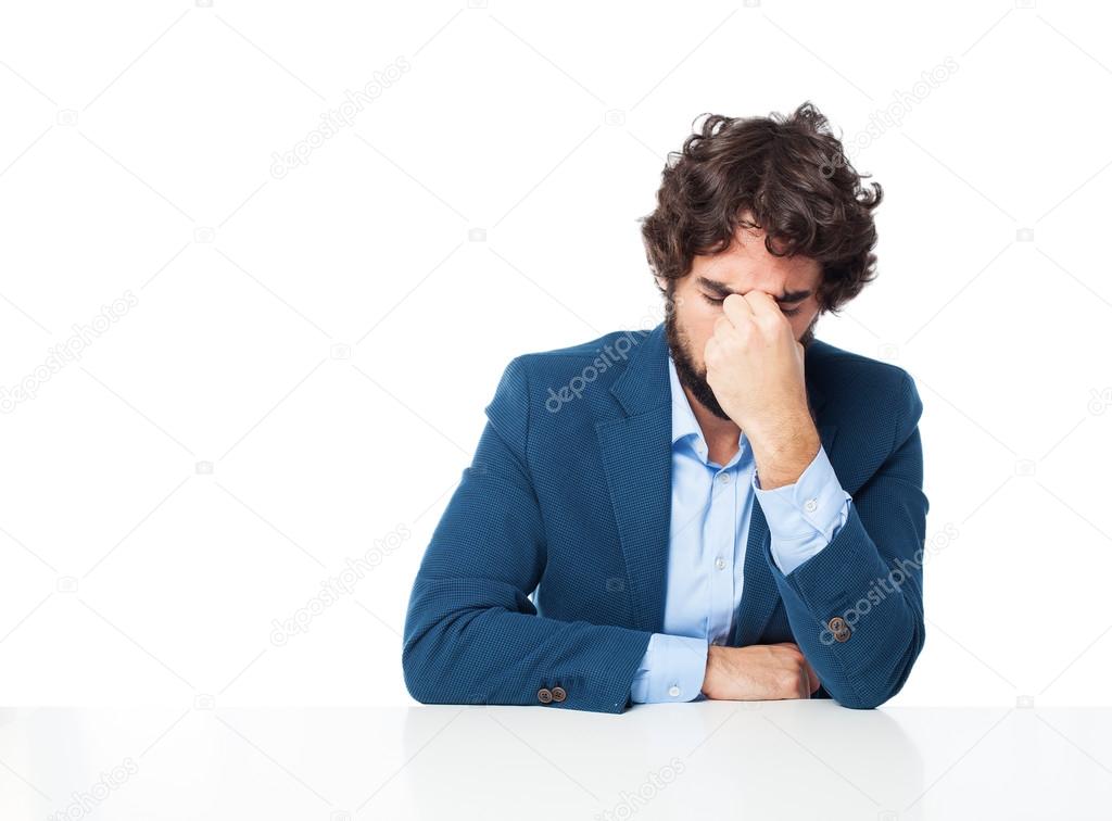 tired businessman with sit table