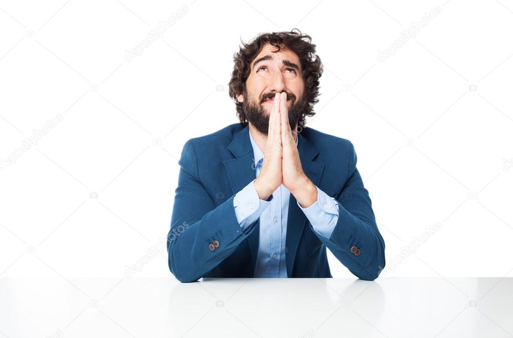 sad businessman praying