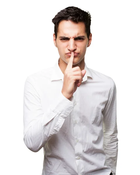 Angry young man with silence gesture — Stock Photo, Image