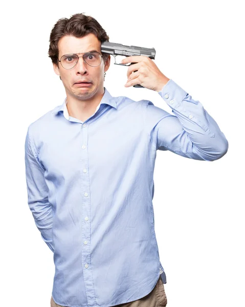 Грустный молодой человек с ружьем — стоковое фото