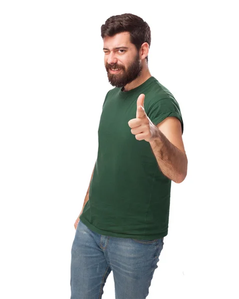 Happy young man pointing front — Stock Photo, Image