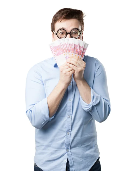 Happy young man with bills — Stock Photo, Image