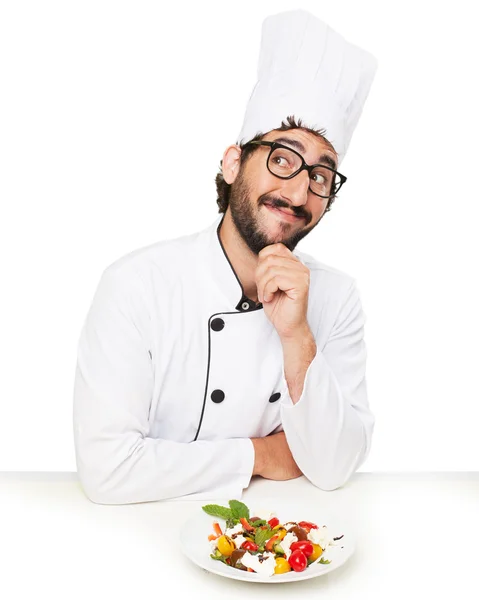 Cook man thinking with salad — Stock Photo, Image