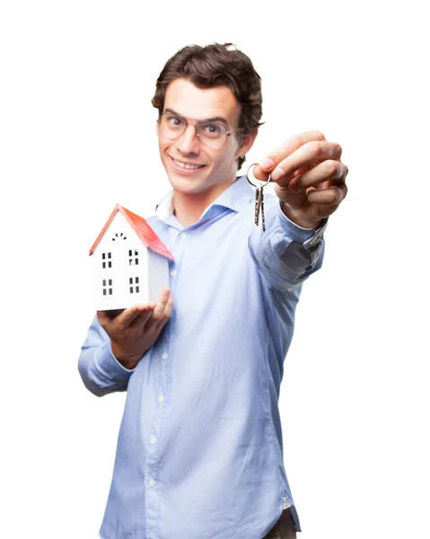 Man with house model and key — Stock Photo, Image
