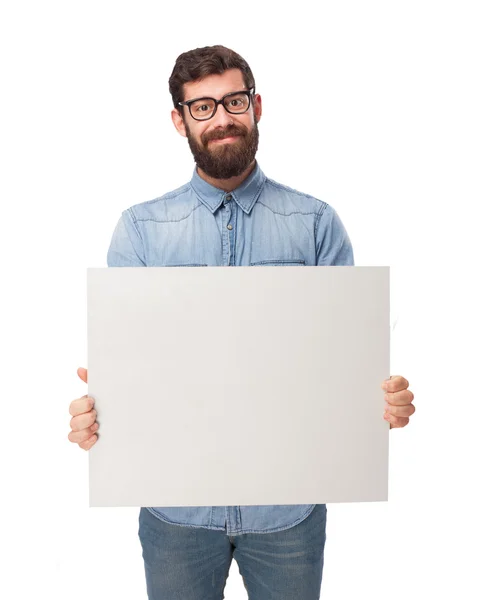 Happy young man with placard — Stock Photo, Image