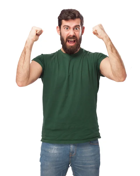 Happy young man with celebrating sign — Stock Photo, Image