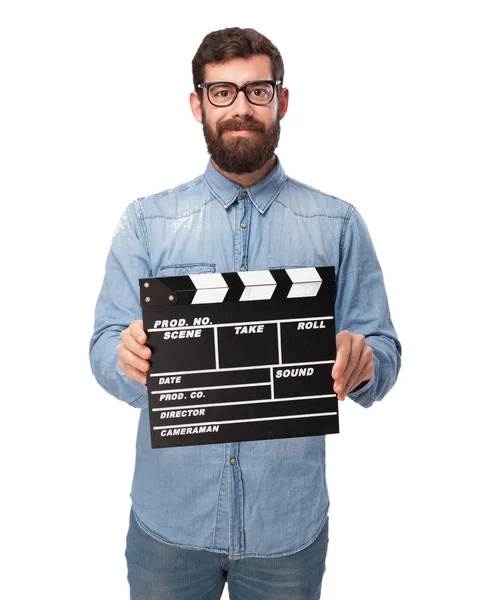 Happy young man with clapper — Stock Photo, Image