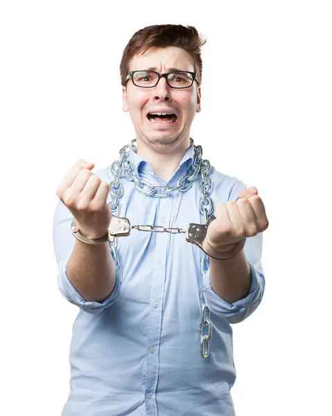 Sad young man with handcuffs — Stock Photo, Image