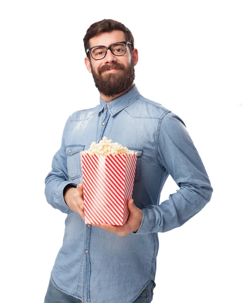 Happy young man with popcorn — Stock Photo, Image