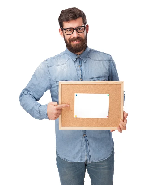 Happy young man with corkboard — Stock Photo, Image