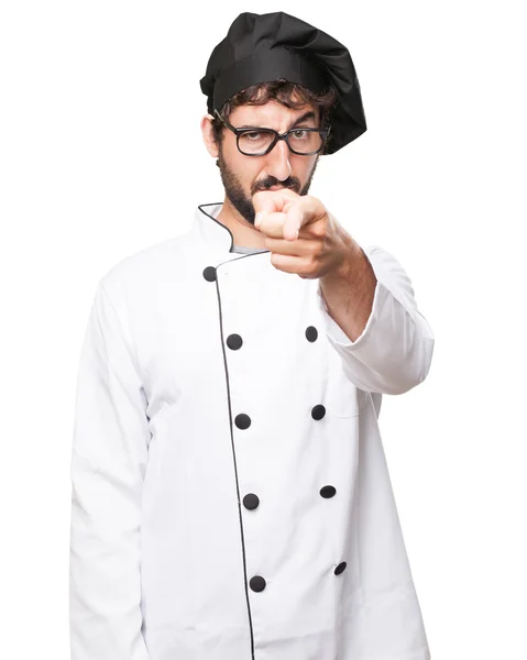 Angry cook man pointing front sign — Stock Photo, Image