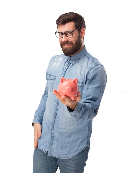 Happy young man with piggy bank — Stock Photo, Image