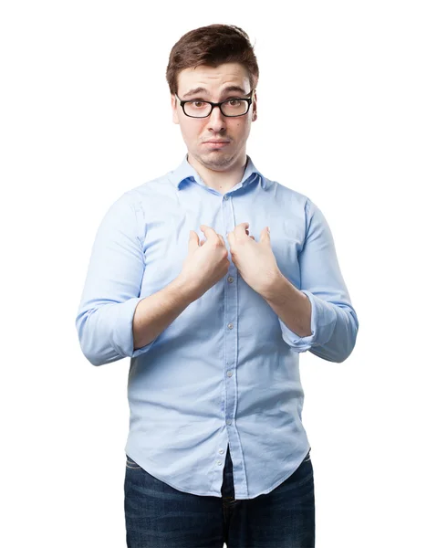 Surprised young man in confused pose — Stock Photo, Image