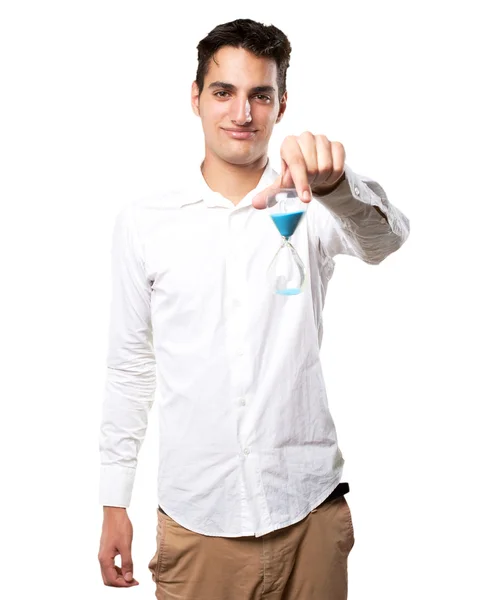 Happy young man with sand timer — Stock Photo, Image