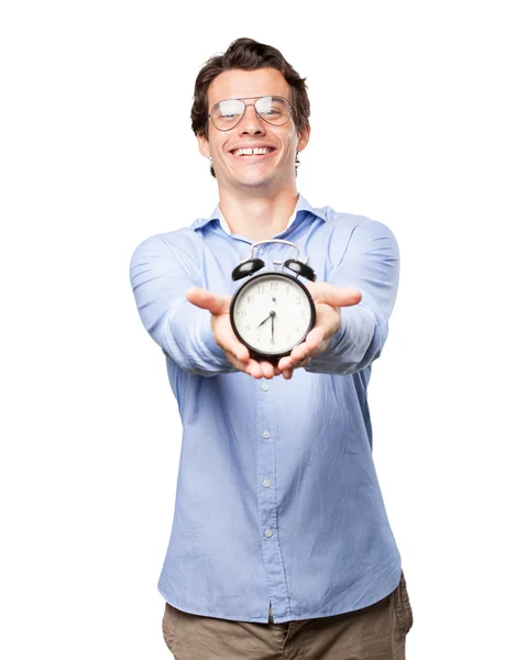 Heureux jeune homme avec horloge — Photo