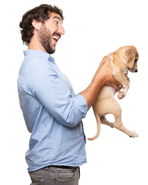 Gelukkig jonge man met puppy — Stockfoto