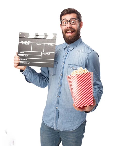 Happy young man with clapper — Stock Photo, Image