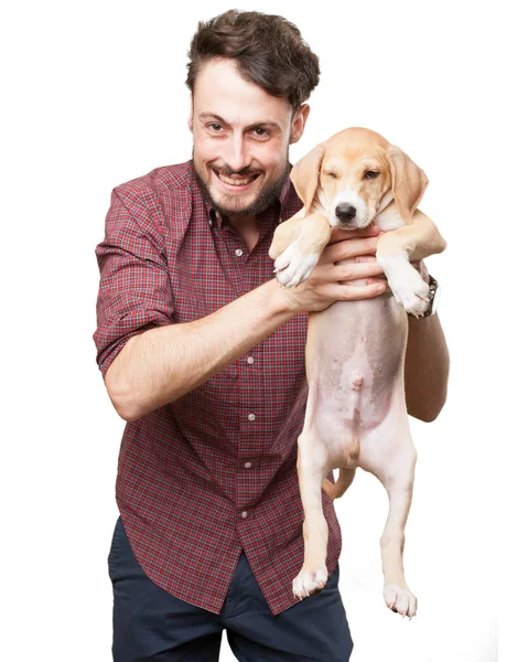 Mutlu genç adam köpek yavrusu — Stok fotoğraf