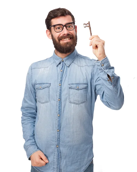 En lykkelig ung mann med vintage nøkkel – stockfoto