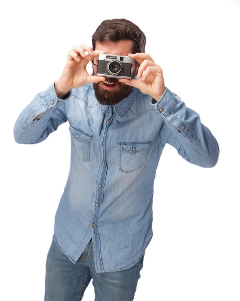 Happy young man with camera — Stock Photo, Image