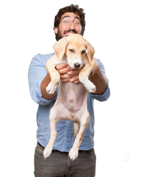 Gelukkig jonge man met puppy — Stockfoto