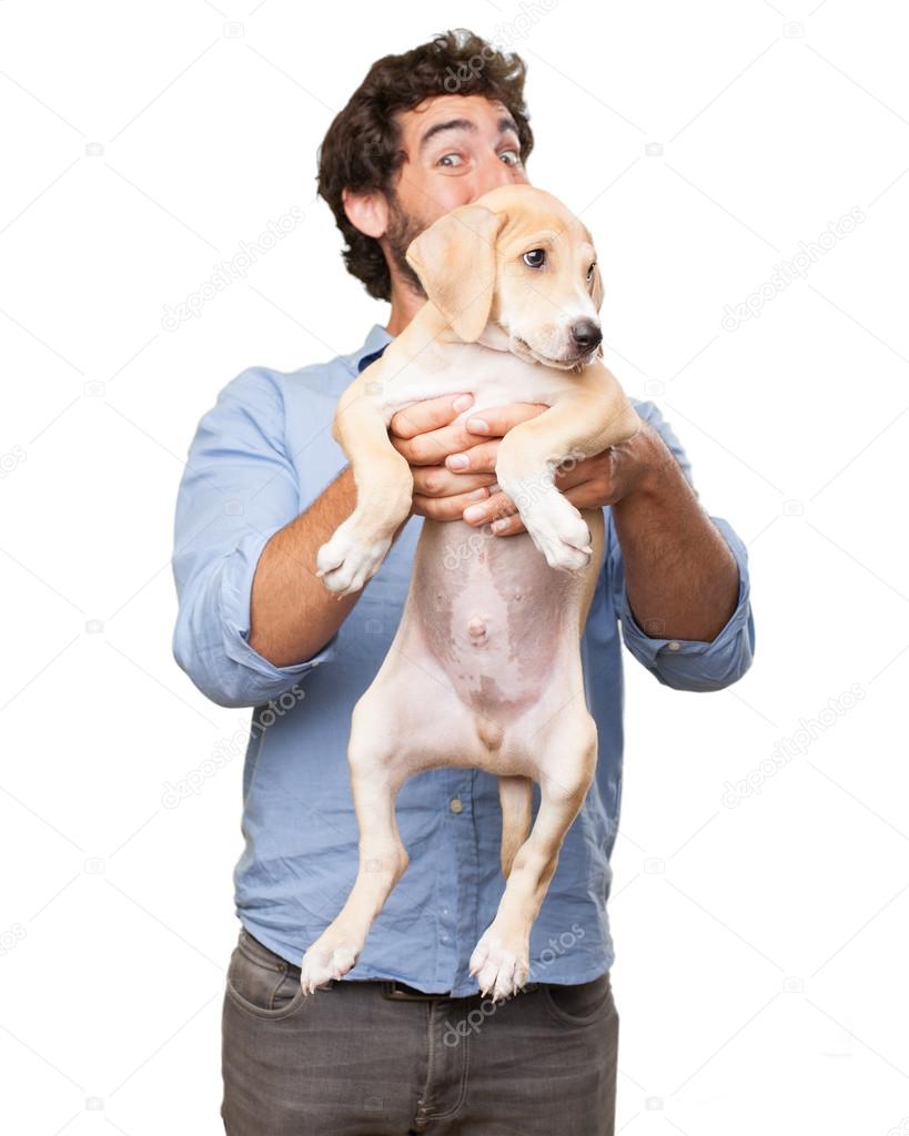 Happy young man with puppy — Stock Photo © kues #83238640