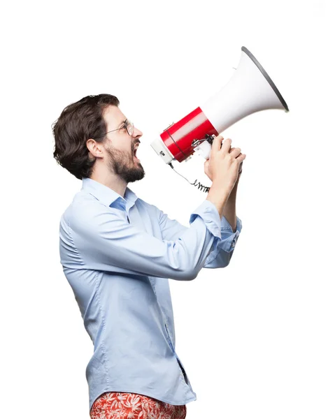 Angry young man met een megafoon — Stockfoto