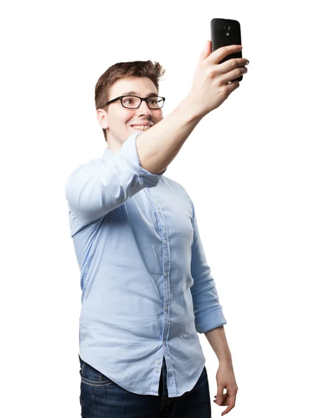 Mies tekee selfie matkapuhelimeen — kuvapankkivalokuva