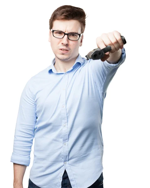 Worried young man with gun — Stock Photo, Image