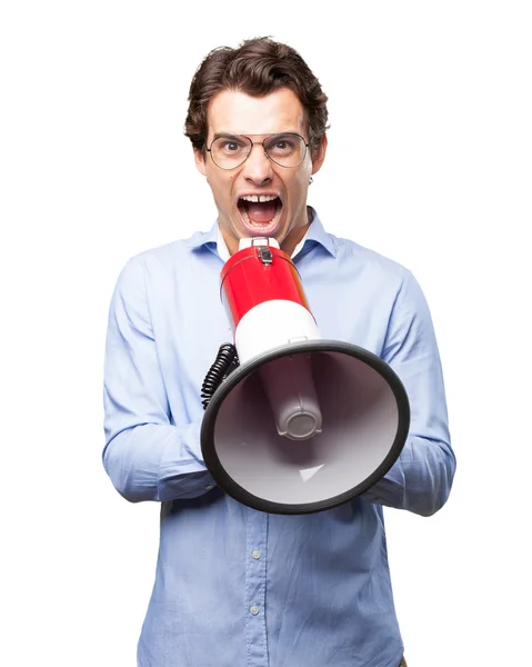 Angry young man met een megafoon — Stockfoto