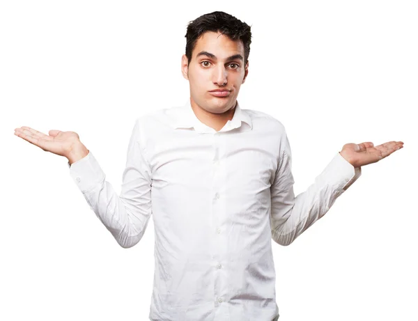 Happy young man in confused pose — Stock Photo, Image