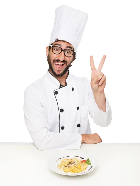 Cocinero hombre victoria signo con pasta — Foto de Stock