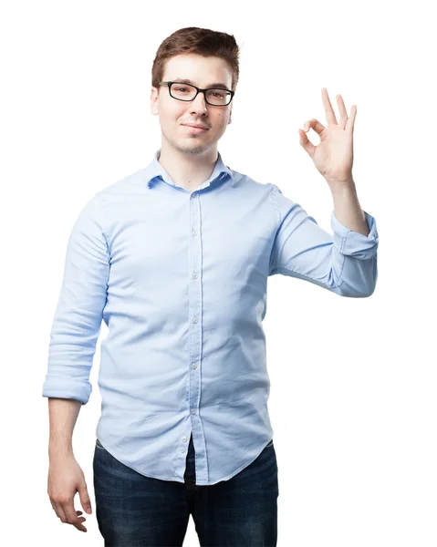 Proud young man with allright sign — Stock Photo, Image