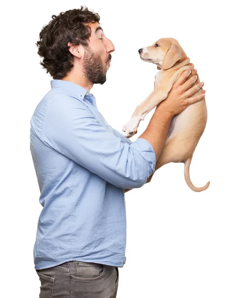 Šťastný mladý muž s štěně — Stock fotografie