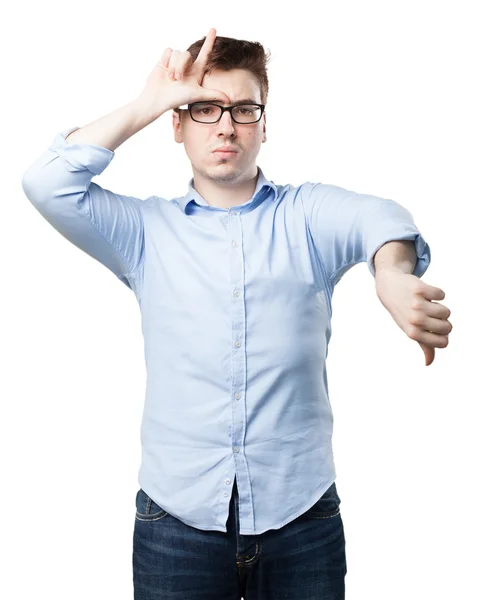 Angry young man with loser sign — Stock Photo, Image