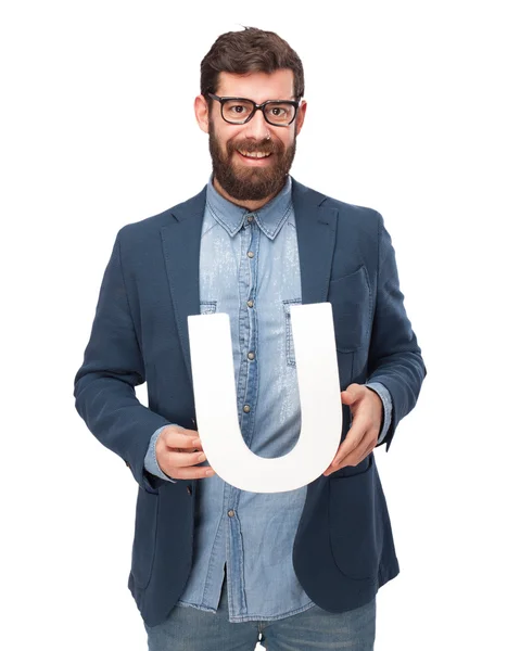 Glad affärsman innehav bokstaven U — Stockfoto